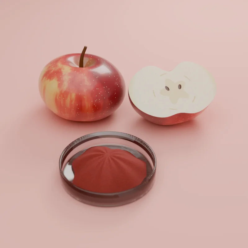 Annurca apples with the red apple extract powder in a glass dish